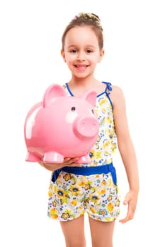 Happy young girl with a new piggy bank to start her savings