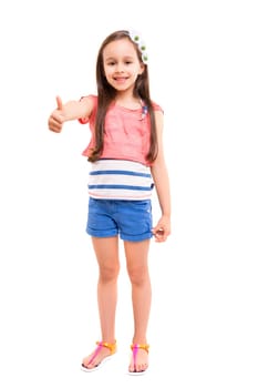 Small girl showing thumbs up, isolated over white background