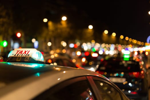 French taxi with the champs elysees avenue in background