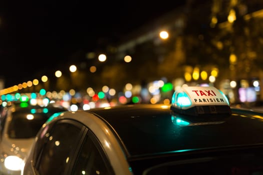 French taxi with the champs elysees avenue in background