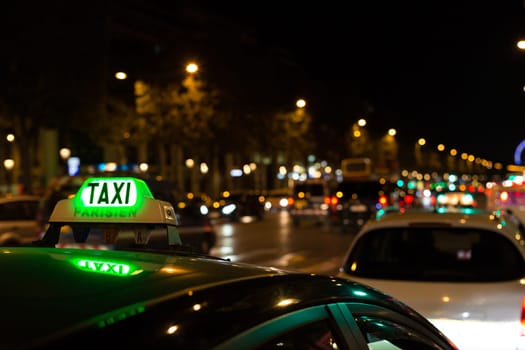 French taxi with the champs elysees avenue in background