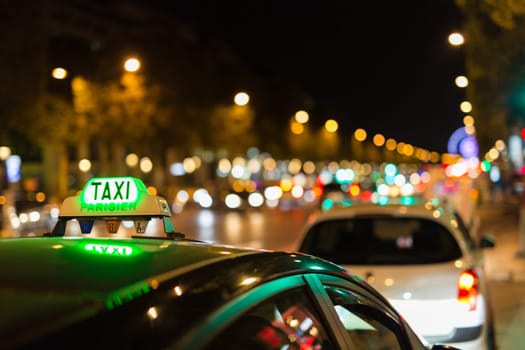 French taxi with the champs elysees avenue in background