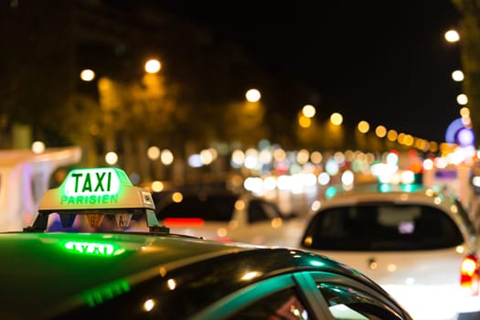 French taxi with the champs elysees avenue in background