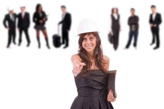 Young engineer posing with some people in the back