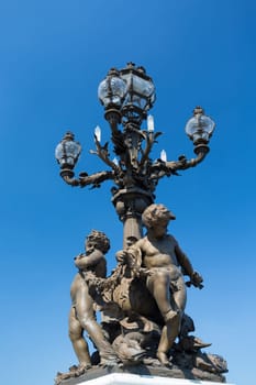 Lamp in the beautiful Alexander III bridge in Paris