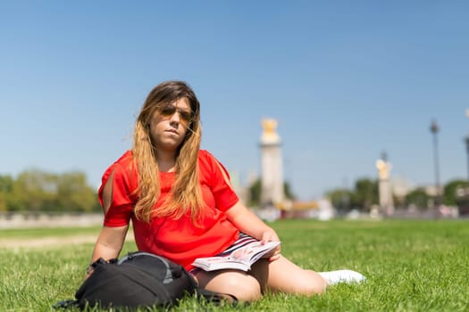 Lucky girl relaxing in the gardens next to the Invalides and the Alexander the 3rd bridge in Paris