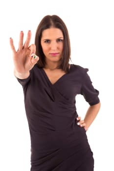 Very beautiful young woman signaling ok, isolated over white