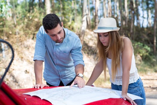 Young couple on roadtrip through countryside
