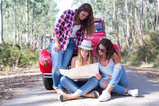 Group of friends on a roadtrip through countryside