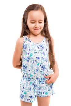 Small girl playing and making a silly expression - isolated over white