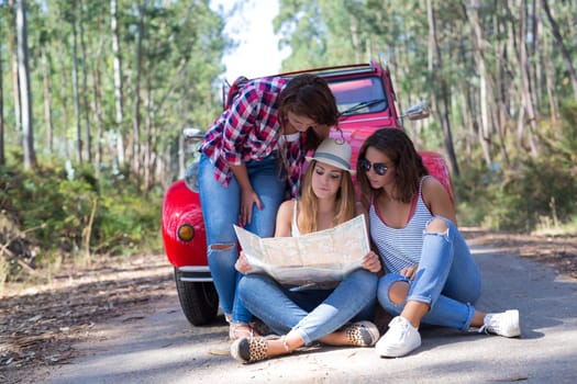 Group of friends on a roadtrip through countryside