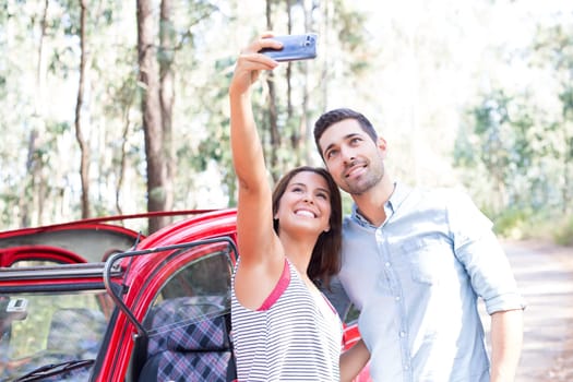 Young couple on roadtrip through countryside
