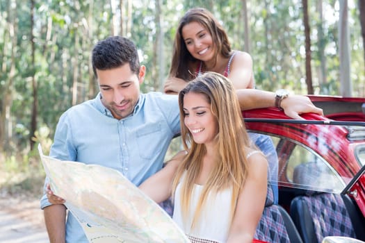 Group of friends on a roadtrip through countryside
