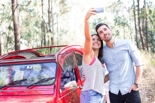 Young couple on roadtrip through countryside