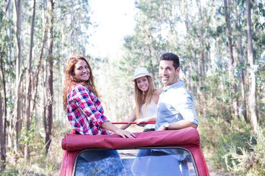 Group of friends on a roadtrip through countryside