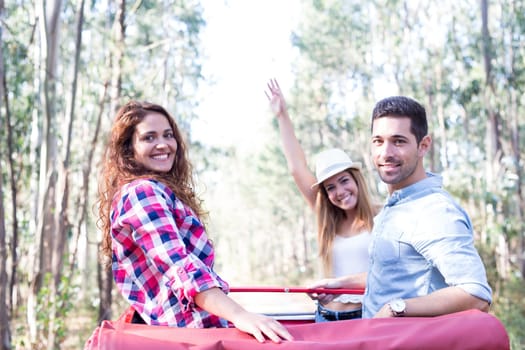 Group of friends on a roadtrip through countryside