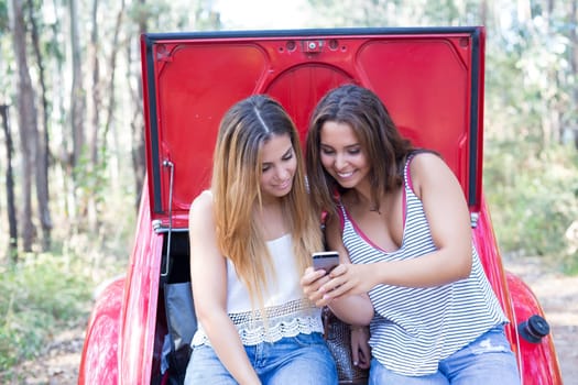 Group of friends on a roadtrip through countryside