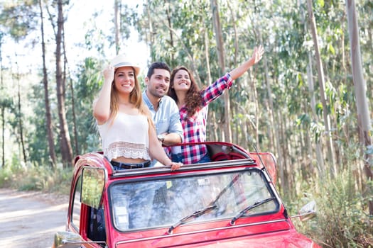 Group of friends on a roadtrip through countryside