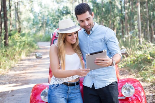 Young couple on roadtrip through countryside