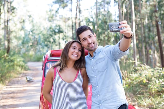 Young couple on roadtrip through countryside