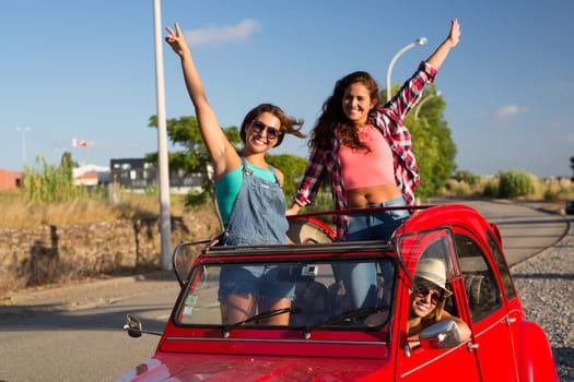Group of friends on a roadtrip through countryside