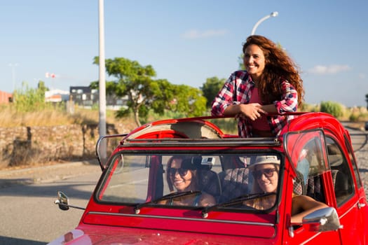 Group of friends on a roadtrip through countryside