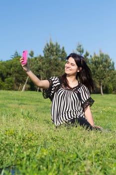 A beautiful young woman relaxing at the city park