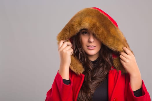 A beautiful young woman dressed for winter