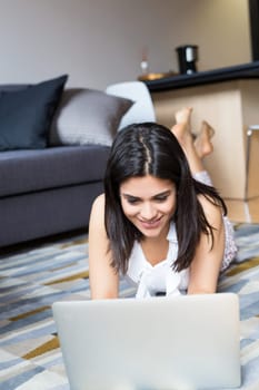 Beautiful woman relaxing with a computer