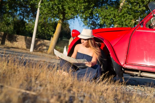 Woman going on a roadtrip in her convertible car