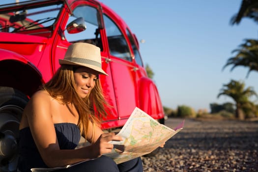 Woman going on a roadtrip in her convertible car