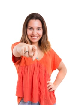 Young beautiful woman pointing at you, isolated over white