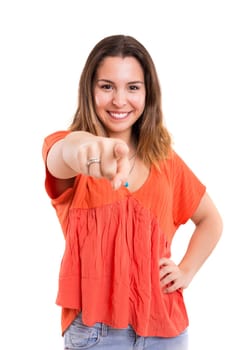 Young beautiful woman pointing at you, isolated over white
