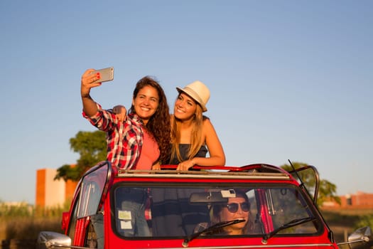 Group of friends on a roadtrip through countryside