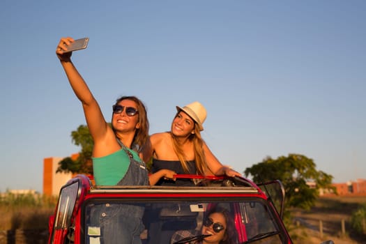 Group of friends on a roadtrip through countryside