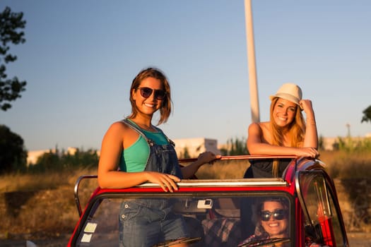 Group of friends on a roadtrip through countryside