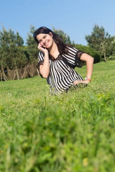A beautiful young woman relaxing at the city park