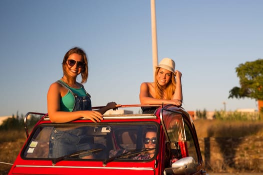 Group of friends on a roadtrip through countryside