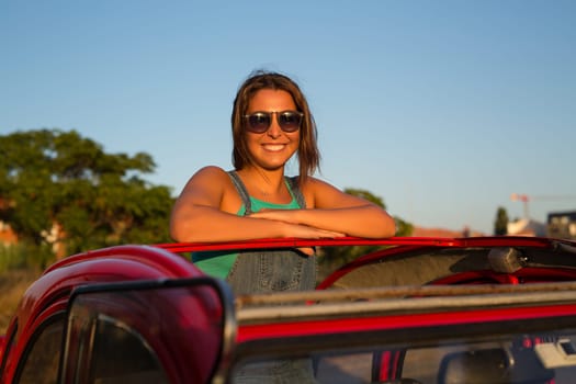 Woman going on a roadtrip in her convertible car