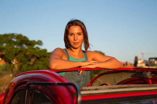Woman going on a roadtrip in her convertible car