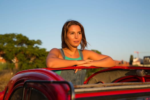 Woman going on a roadtrip in her convertible car