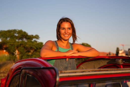 Woman going on a roadtrip in her convertible car