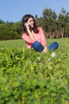 A beautiful young woman relaxing at the city park