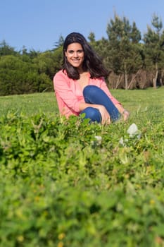 A beautiful young woman relaxing at the city park