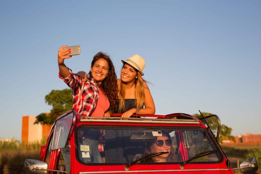 Group of friends on a roadtrip through countryside