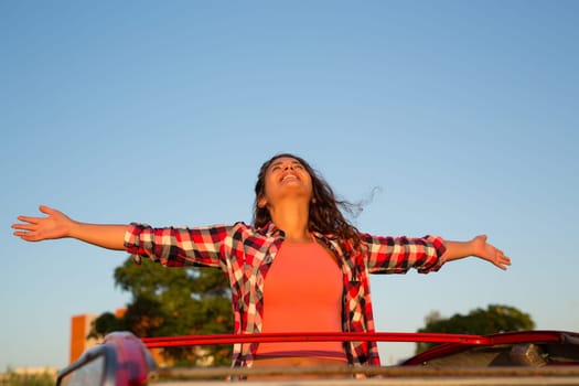 Woman going on a roadtrip in her convertible car