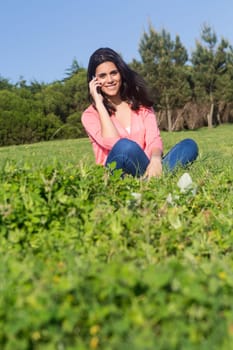 A beautiful young woman relaxing at the city park
