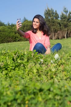 A beautiful young woman relaxing at the city park