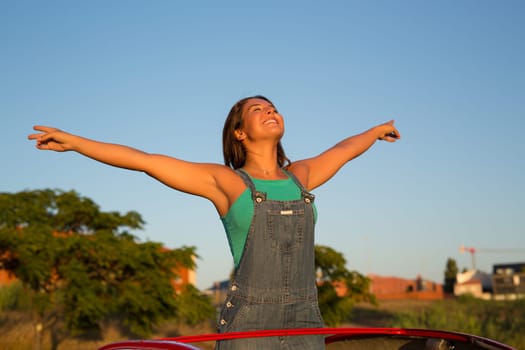 Woman going on a roadtrip in her convertible car