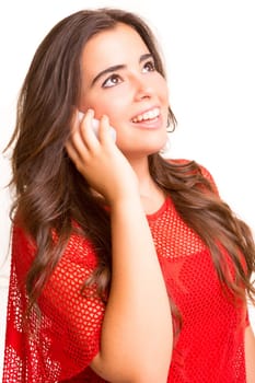 Teenager with cellphone, posing over a white background